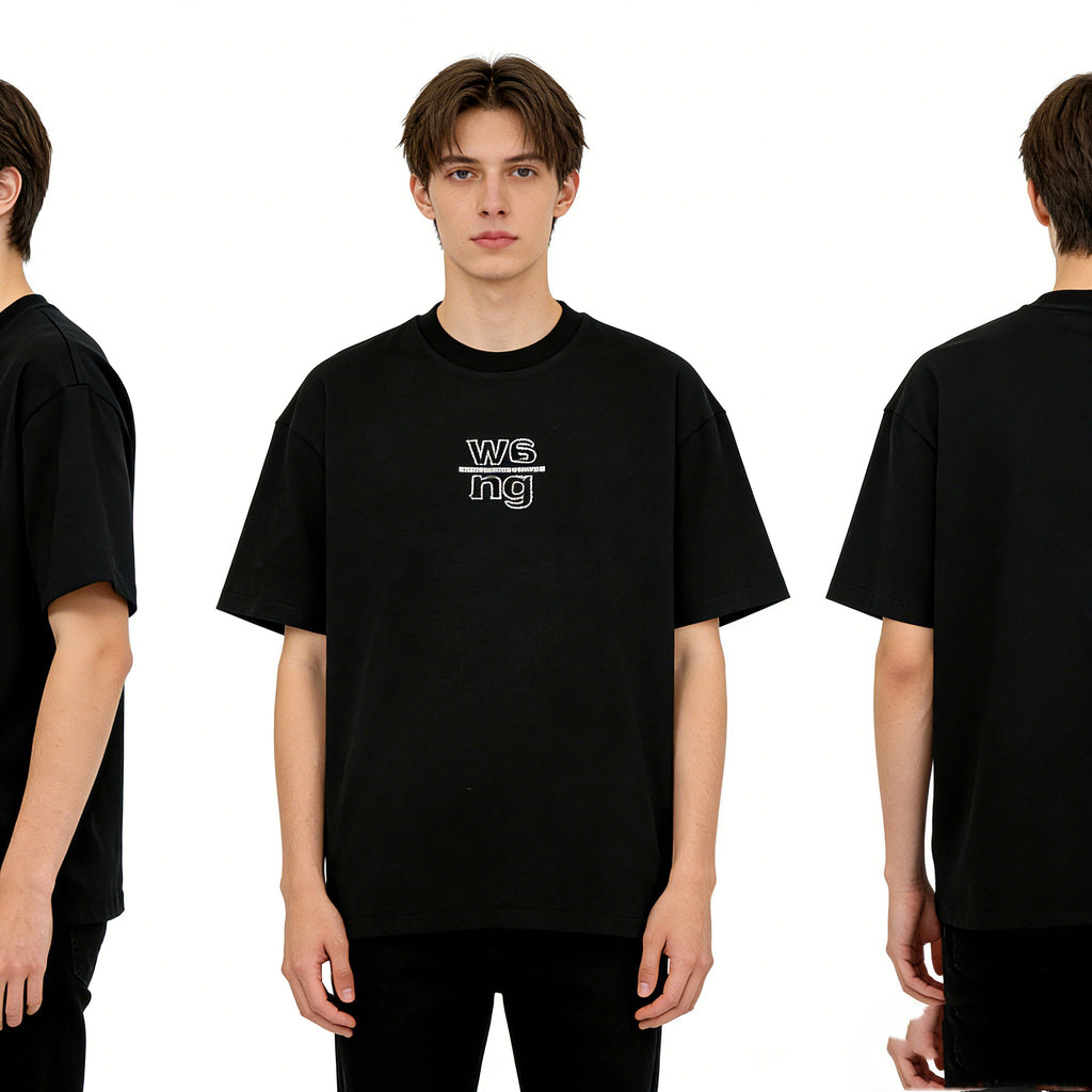 Model Wearing Minimalist Embroidered Oversized Black Tee High Street Style