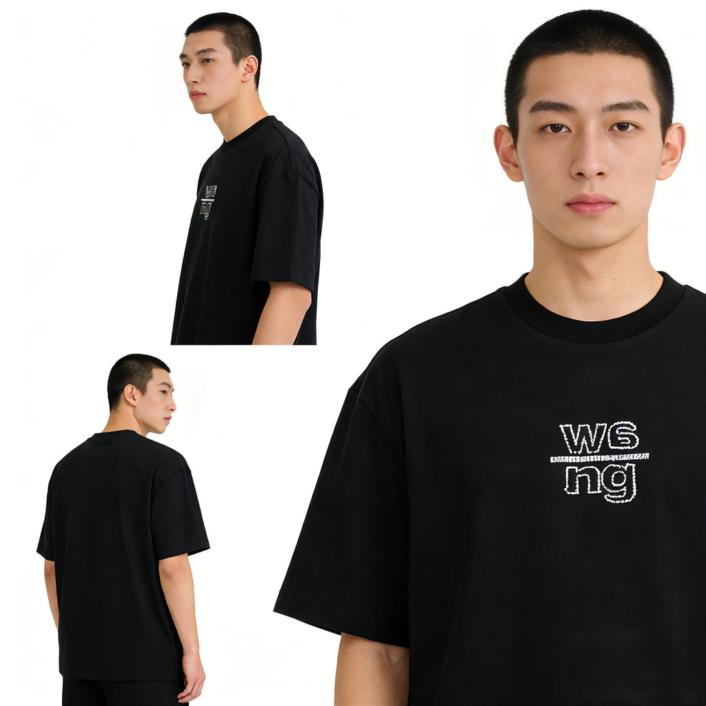 Model Wearing Minimalist Embroidered Oversized Black Tee High Street Style